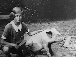 Mum with her pet pig circa 1930. Her pig would come into the house to sit beside her when she took piano lessons